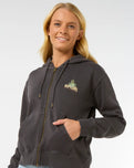 The Rip Curl Womens La Paloma Relaxed Zip Thru Hoodie in Washed Black