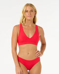 The Rip Curl Womens Premium Surf D-DD Deep V Bikini Top in Hibiscus Red