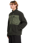 The Volcom Mens Storm Stone Fleece Jacket in Rinsed Black