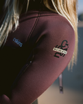 The C-Skins Womens NuWave Surflite 5/4mm Back Zip Wetsuit in Black, Rust & Yellow
