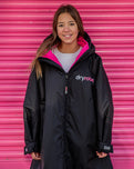 The Dryrobe Kids Advance Long Sleeved Dryrobe in Black & Pink